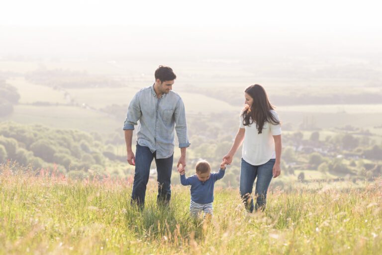 Life Insurance Protected Family in Field Happy